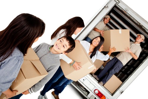 Van loading recyclable cardboard and reusable items in Mayfair