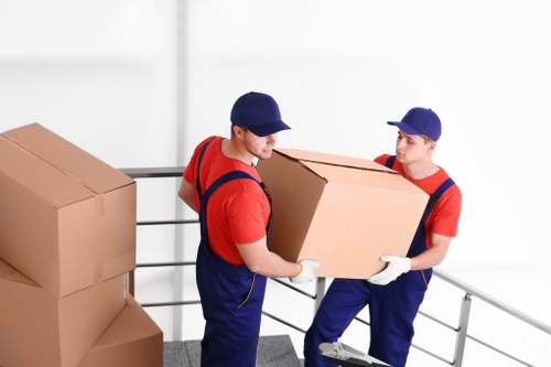 Local removal team handling a move in a Mayfair townhouse street