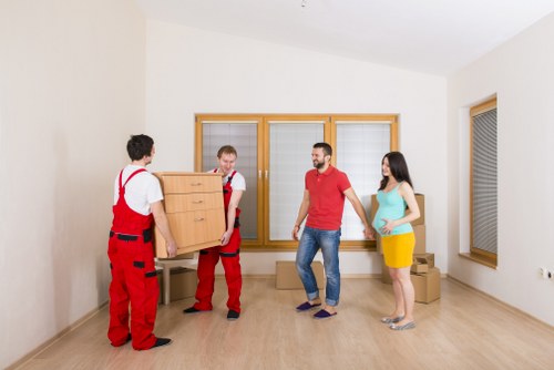 Careful piano relocation through a narrow staircase in Mayfair