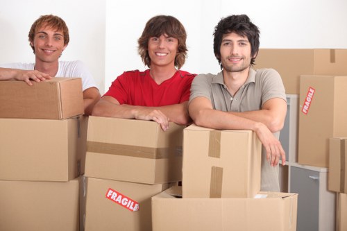 Professional mover checking access and protecting furniture