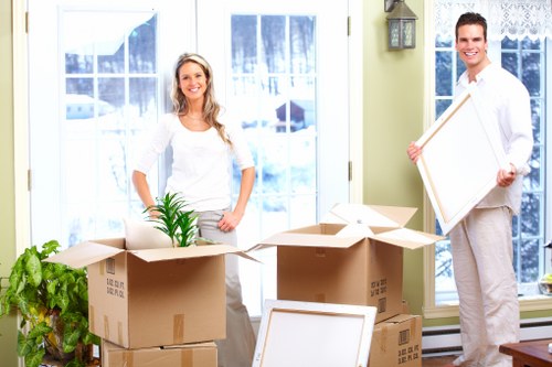 Professional office moving service with labelled boxes and equipment